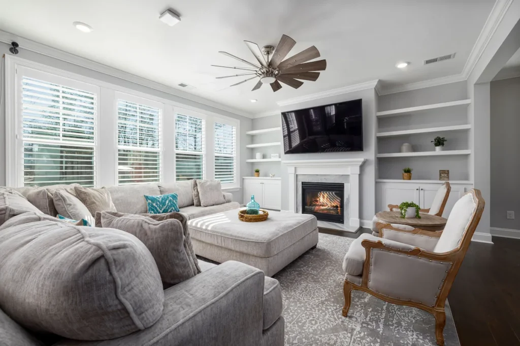 A spacious modern living room with a comfortable grey sofa, representing the 2-bedroom apartment and home moving services provided by Atlantis Removals in Newcastle.
